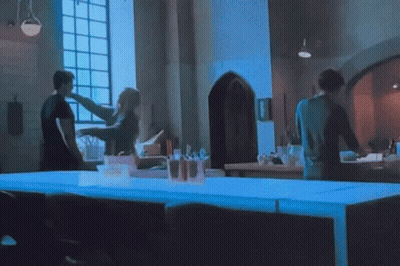 Group Of People Standing Around Table GIF