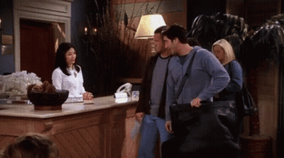 Group Of People Standing At Hotel Lobby Counter GIF