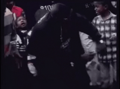 Group Of People Standing In Crowd Talking GIF