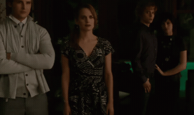 Group Of People Standing In Dark Room GIF