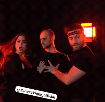 Group Of People Standing In Dark Room GIF