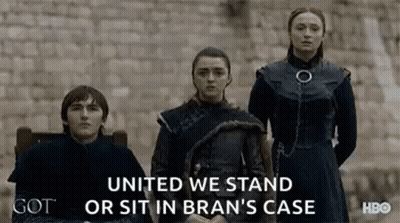 Group Of People Standing In Front Of Brick Wall GIF