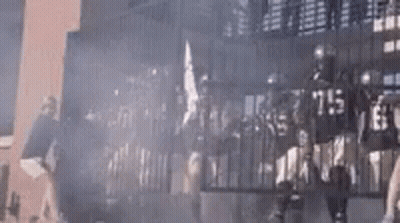 Group Of People Standing In Front Of Building GIF