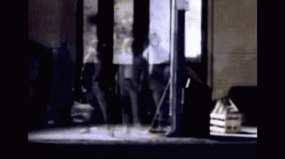 Group Of People Standing In Front Of Building GIF