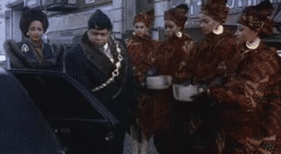 Group Of People Standing In Front Of Building GIF