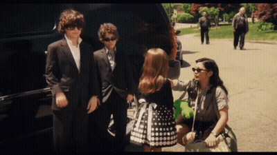 Group Of People Standing In Front Of Car GIF