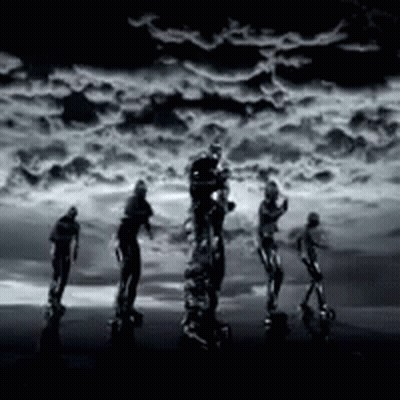 Group Of People Standing In Front Of Cloudy Sky GIF