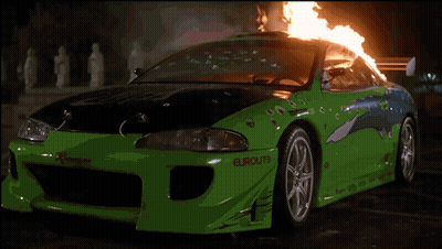Group Of People Standing In Front Of Fire At Night GIF