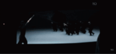 Group Of People Standing In Front Of Large Building GIF