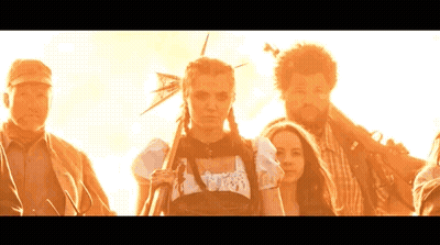 Group Of People Standing In Front Of Sun GIF