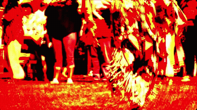 Group Of People Standing In Red And Yellow Field GIF
