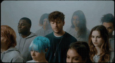 Group Of People Standing In Room GIF