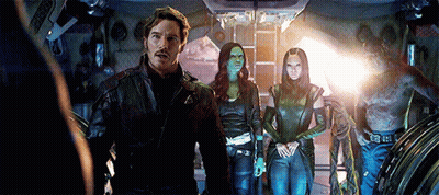 Group Of People Standing In Room GIF