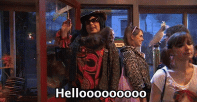 Group Of People Standing In Room Saying Hello GIF