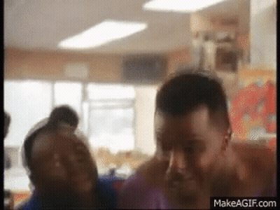 Group Of People Standing In Room With Makeagif.com Logo GIF