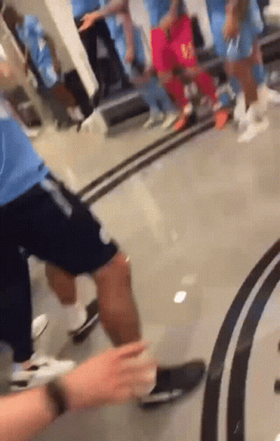 Group Of People Standing In Room With Mirror GIF