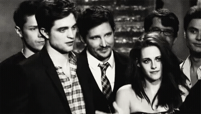 Group Of People Standing Next To Each Other In Room GIF