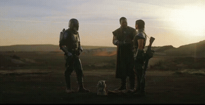 Group Of People Standing On Dirt Field GIF
