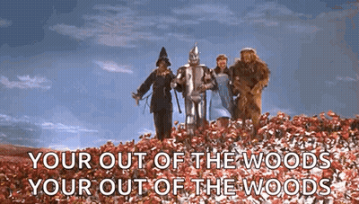 Group Of People Standing On Hill Of Flowers GIF