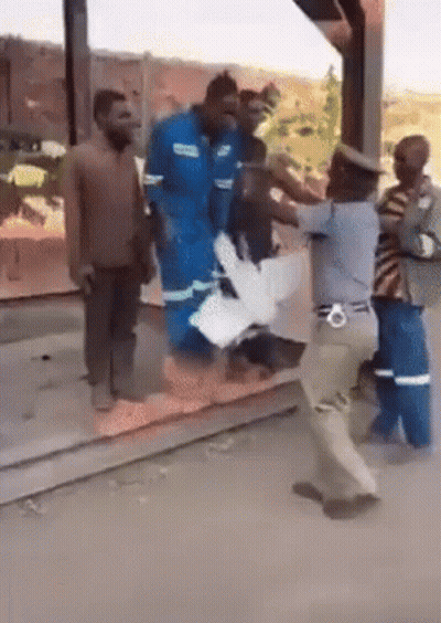 Group Of People Standing On Sidewalk GIF