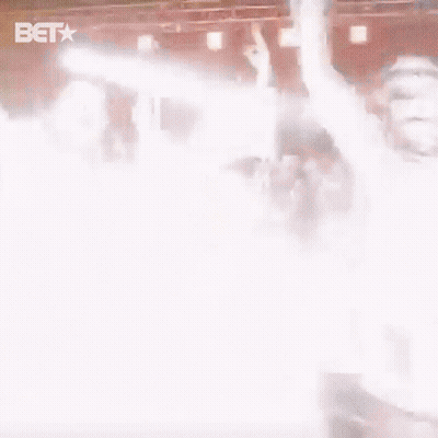 Group Of People Standing On Stage With BET Logo GIF