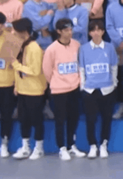 Group Of People Standing Together GIF