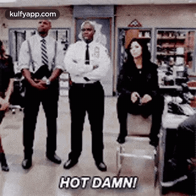 Group Of People Standing With Woman On Stool GIF