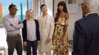 Group Of People Talking To Man In Suit GIF