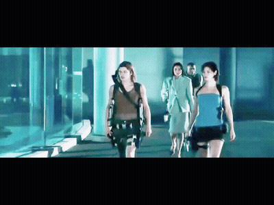 Group Of People Walking In Dark Room GIF