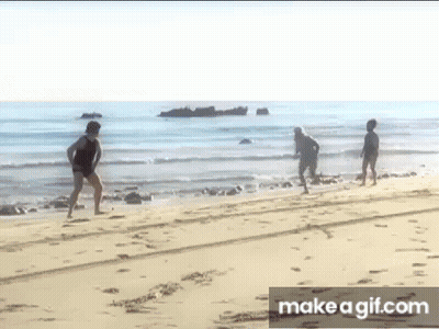 Group Of People Walking On Beach GIF