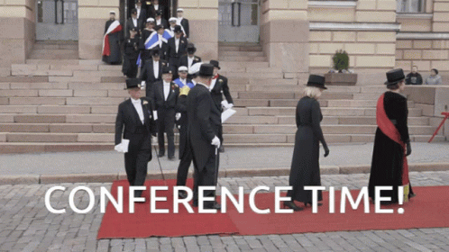 Group Of People Walking On Red Carpet With Conference Time GIF