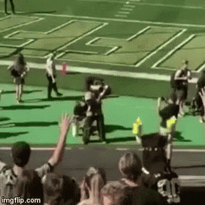 Group Of People With Arms In Air On Football Field GIF