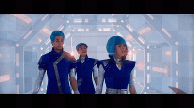 Group Of People With Blue Hair In Hallway GIF