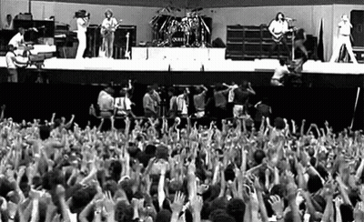 Group Of People With Hands In Air At Concert GIF