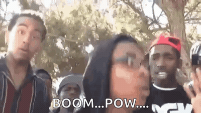 Group Of People With Woman Blowing Kiss At Man GIF