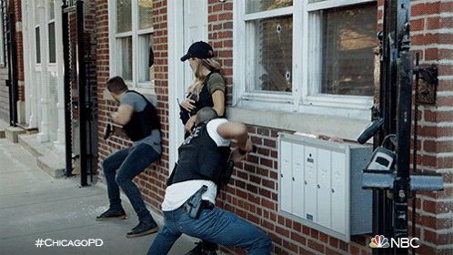Group Of Police Officers In Front Of Brick Building With #Chicagopd GIF