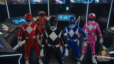 Group Of Power Rangers Standing In Room GIF