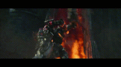 Group Of Robots In Front Of Burning Building GIF