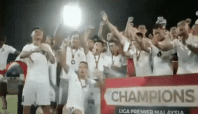 Group Of Soccer Players Holding Champions Trophy GIF