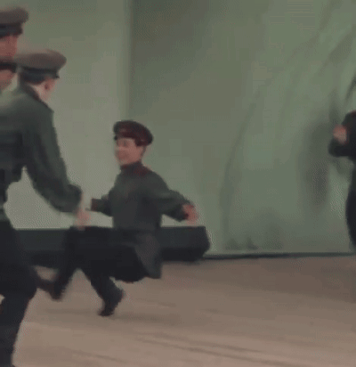 Group Of Soldiers Dancing Together On Stage GIF