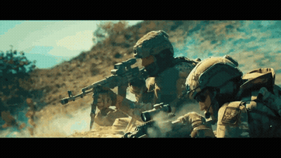 Group of Soldiers Holding Guns in Dirt