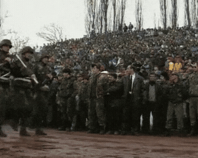 Group Of Soldiers In Front Of Crowd GIF