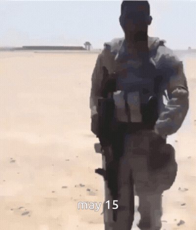 Group Of Soldiers Walking In Desert May 15 GIF