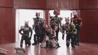 Group Of Superheroes Posing For Photo GIF