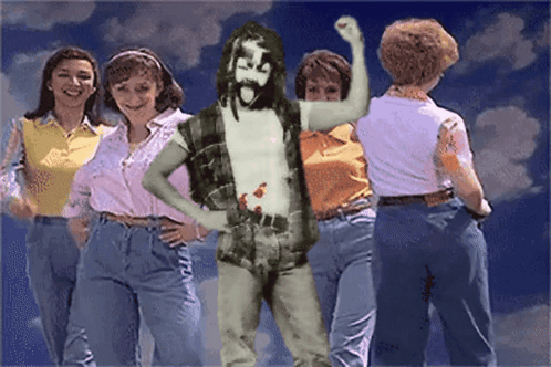 Group Of Women Around Bearded Man GIF