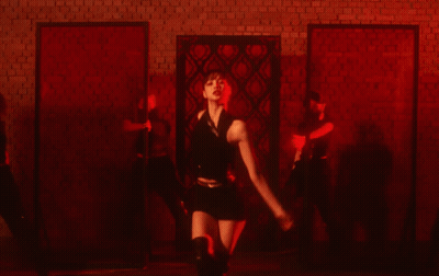 Group Of Women Dancing In Dark Room GIF