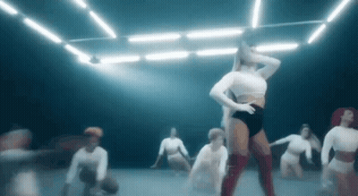 Group Of Women Dancing In Dark Room GIF