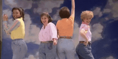 Group of Women Dancing in Front of Cloudy Sky