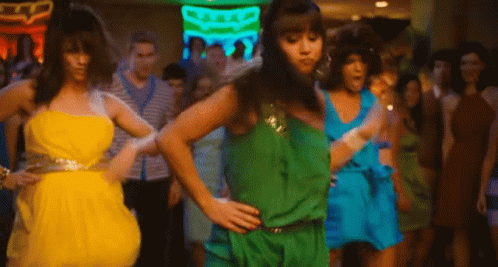 Group Of Women Dancing In Front Of Neon Bar Sign GIF