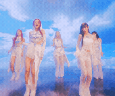 Group Of Women Dancing Under Cloudy Sky GIF